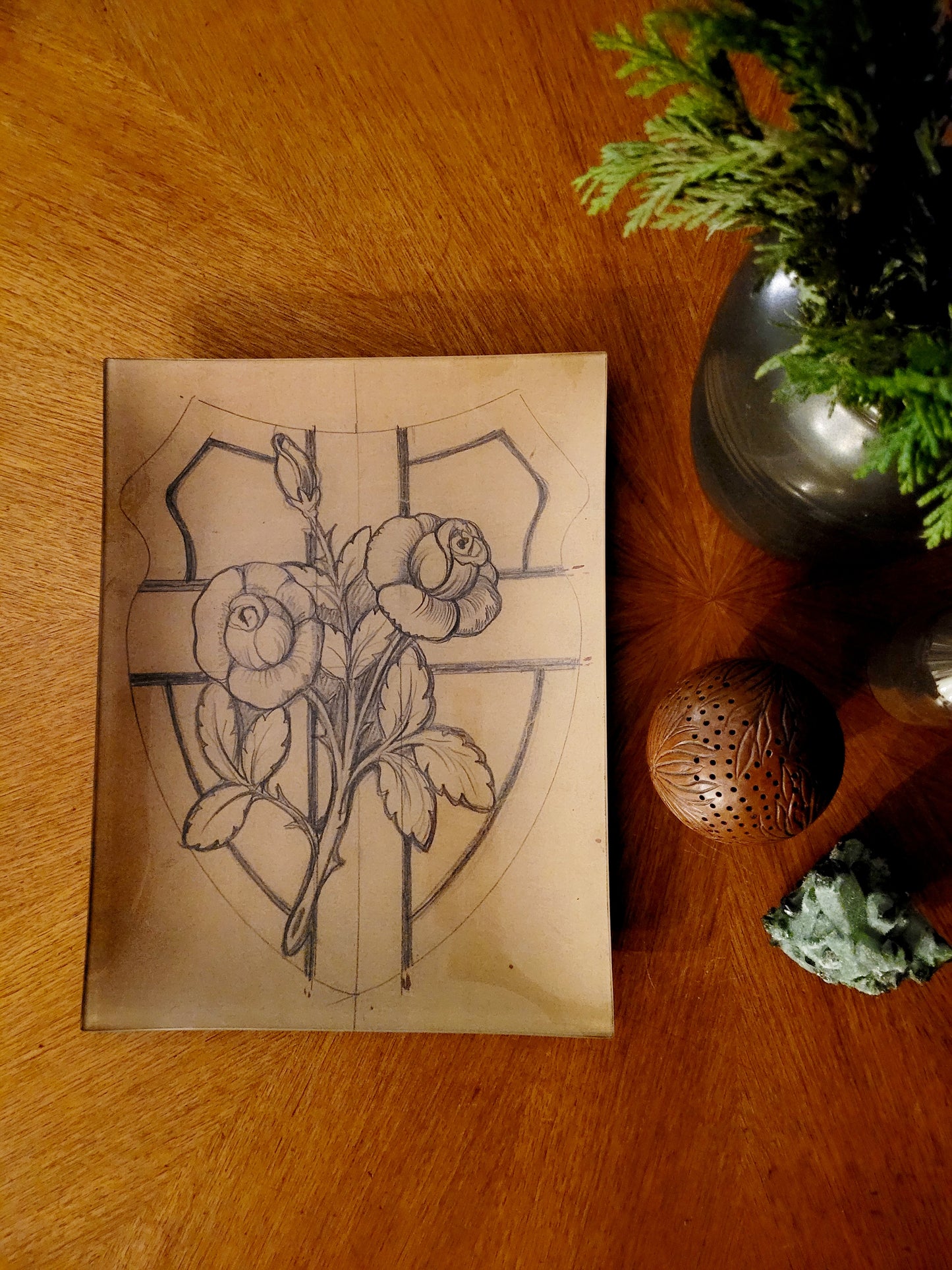 Stained glass with rose and shield plate